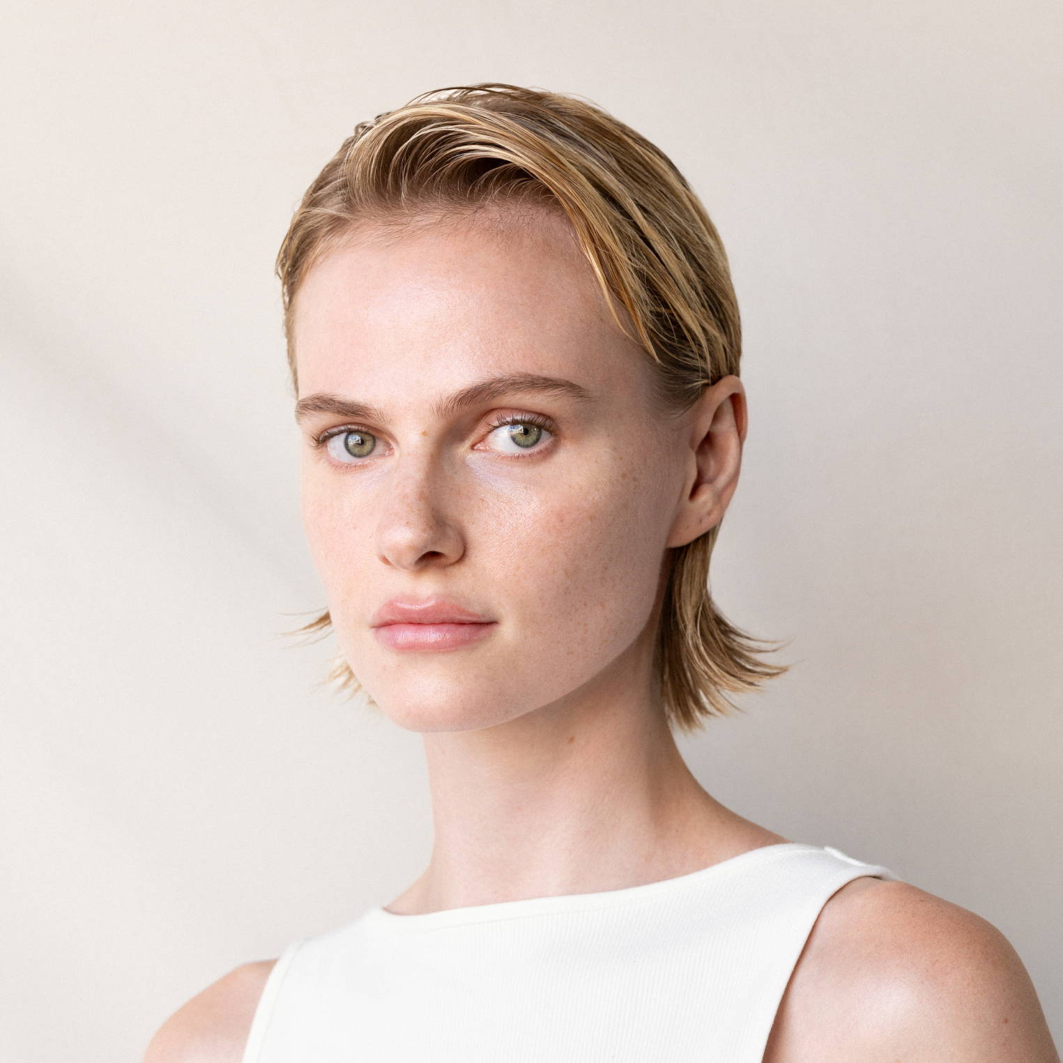 Davines model with slick back hairstyle