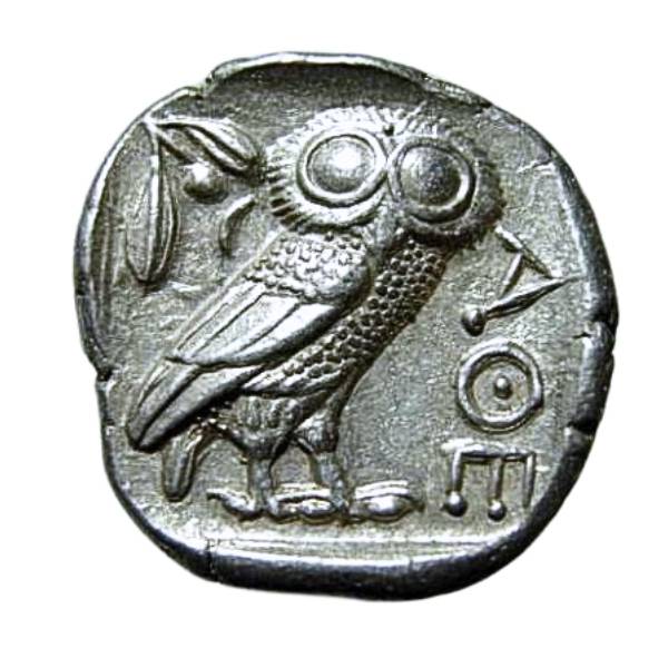 Ancient Greek Athenian tetradrachm with the image of an owl and olive leaves and fruit.