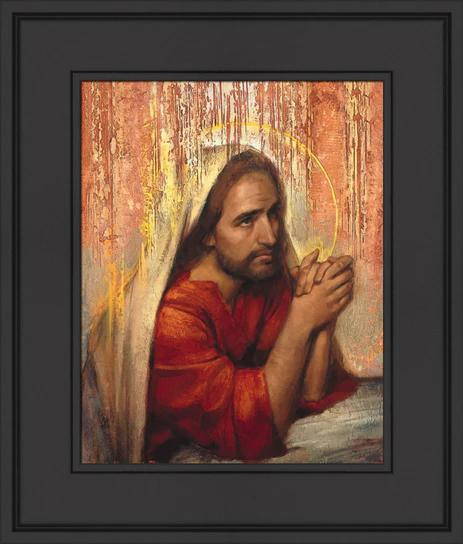 Framed picture of Jesus praying.