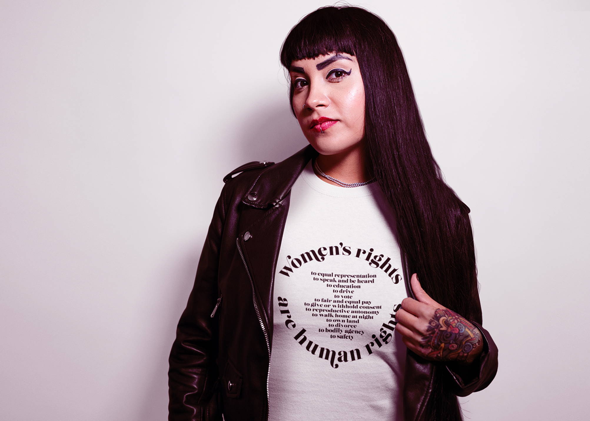Women's Rights Are Human Rights Tshirt worn by model with brunette hair and amazing eyebrows