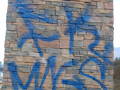 blue tag removed with bare brick stone and masonry graffiti remover