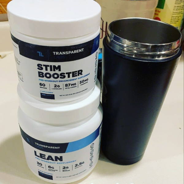 athlete shows his bottle of stim booster