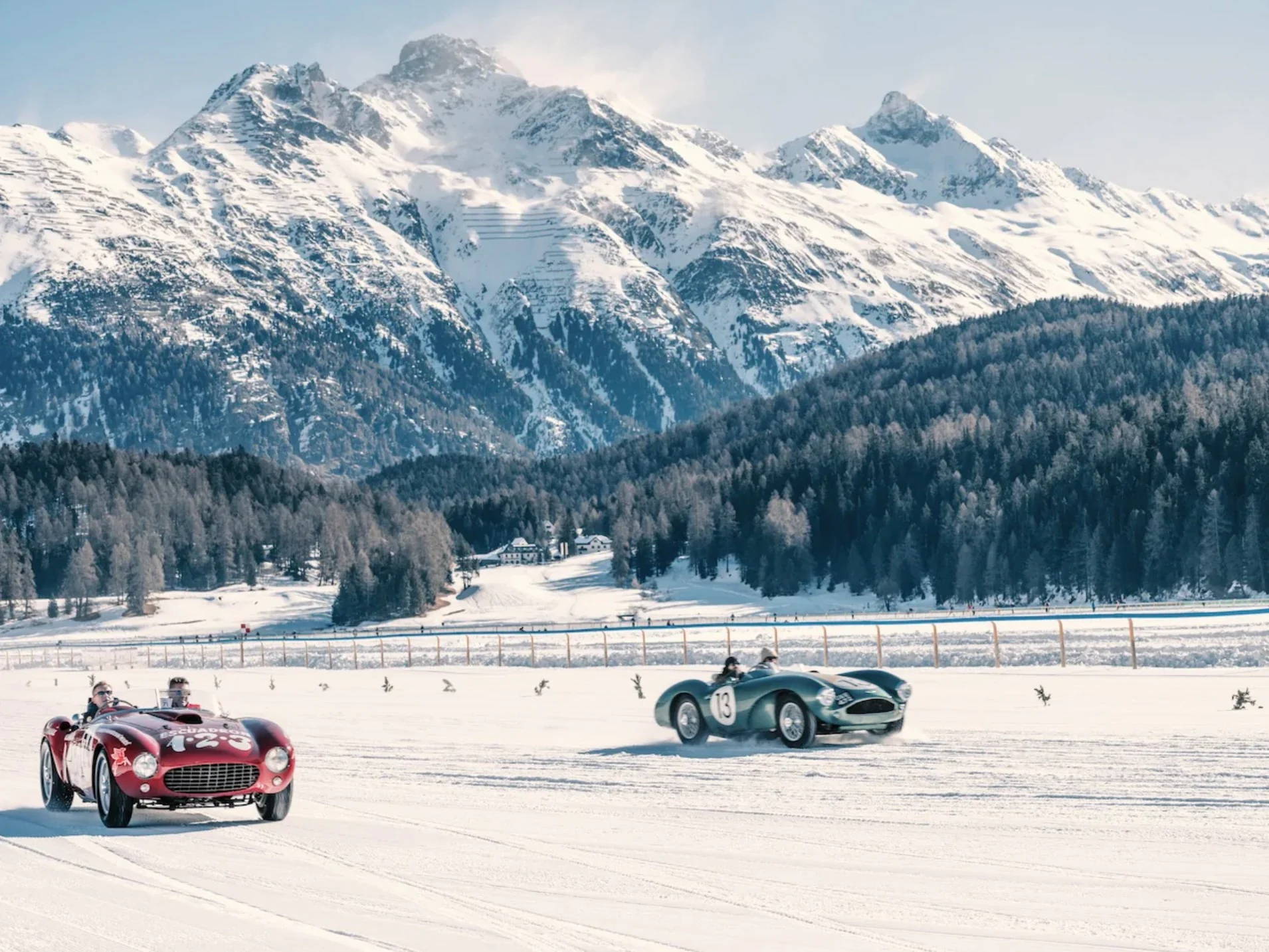 Sun, Speed & Smiles by Stuart Cantor - A photographic print of two vintage cars racing in the snow at St Moritz.