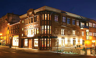 The storefront of Village Books at night