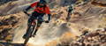 Rider with protective gear on mountain bike
