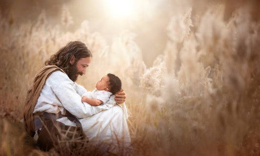 Jesus sitting in a wheatfield with an infant in His arms.