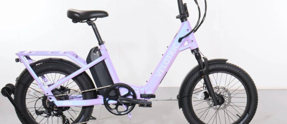 a purple Velotric Fold 1 plus electric folding bike