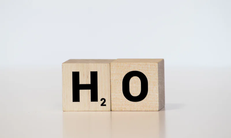 H2O symbol on wooden scrabble tiles