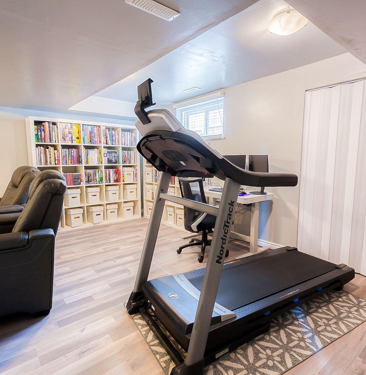 workout area featuring wood-type flooring and natural light