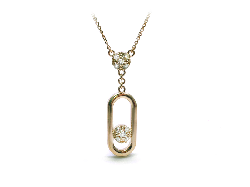 Olympian style pendant with small diamonds in the center and on the belgian side