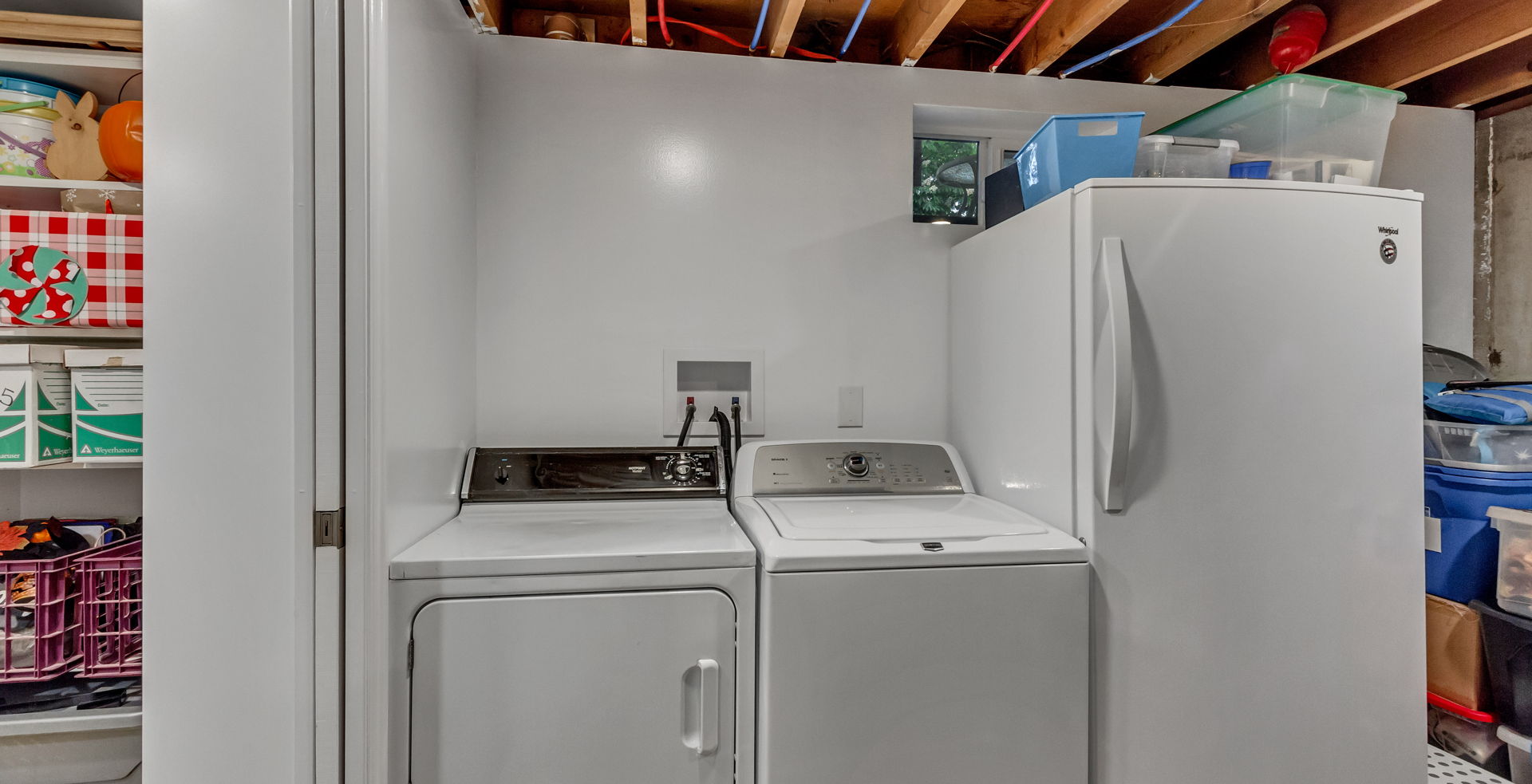 clothes washing area featuring separate washer and dryer
