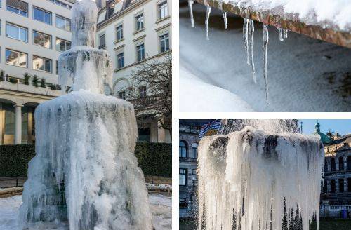 A concrete outdoor fountain with water flowing in the winter