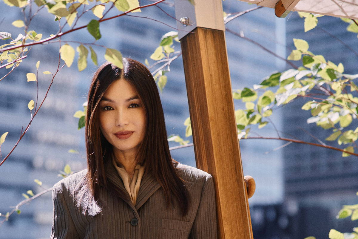 Image may contain: Gemma Chan, Blazer, Clothing, Coat, Jacket, Formal Wear, Suit, Face, Happy, Head, Person, and Smile