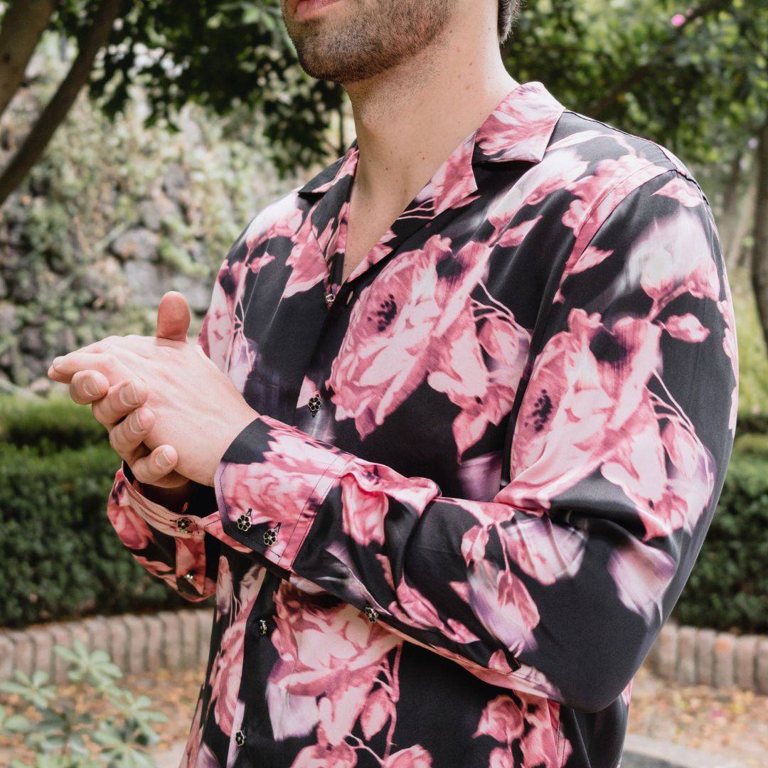 close up photo of a man wearing a black floral long sleeve silk shirt from 1000 kingdoms