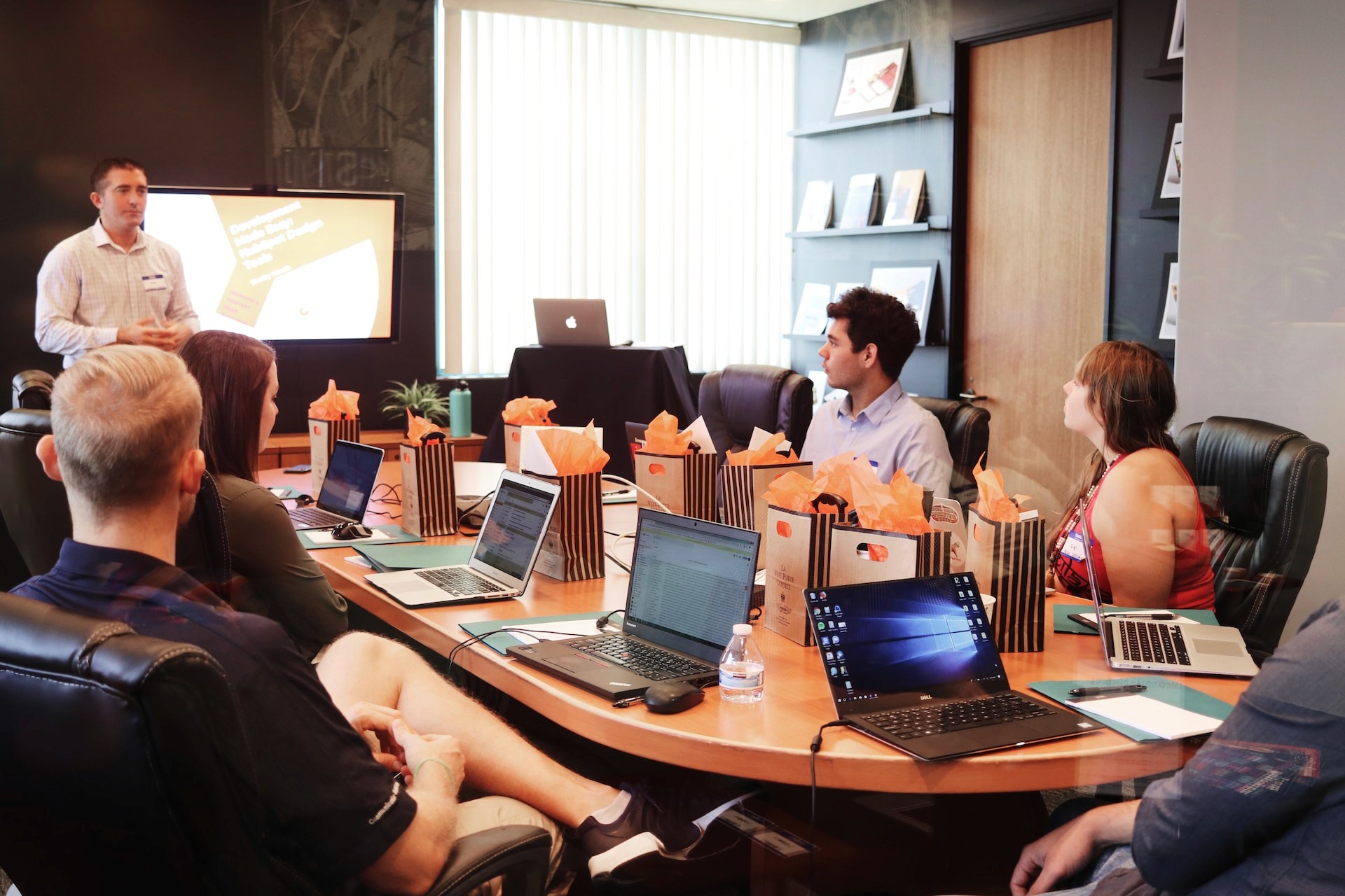 A business meeting underway where a marketing team figures out the best time to post on Reddit