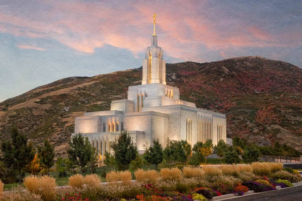 Photo of Draper Temple with a backdrop of hills.