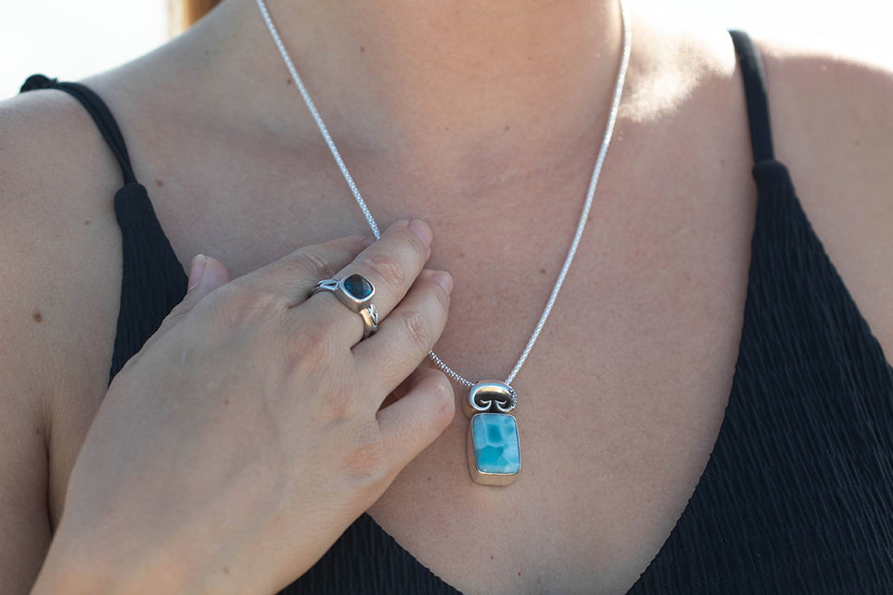 Closeup of a woman wearing a necklace.