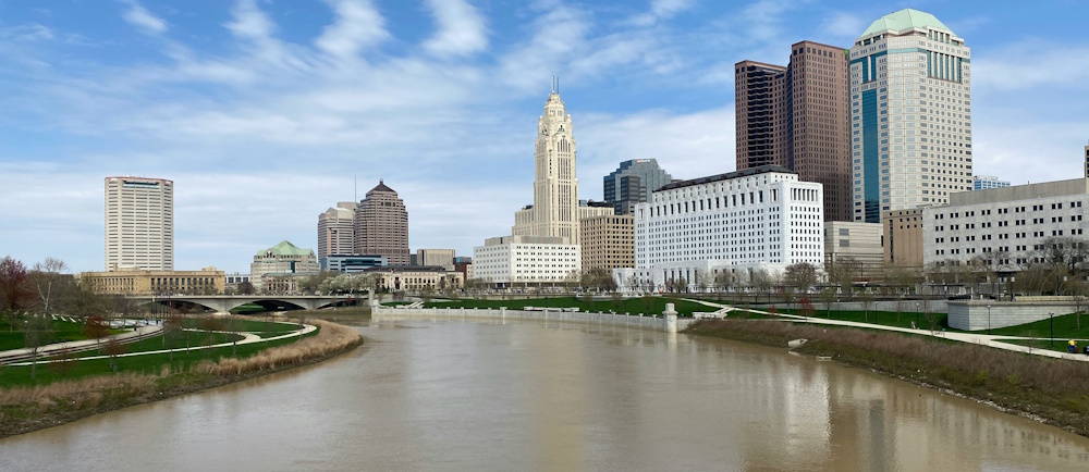 Photo by Julius Kissinger on Unsplash of Columbus Ohio skyline with river in the foreground