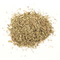 A small pile of dried, chopped herbs on a white background.