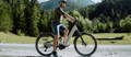 Rider on adventure electric bike on gravel trail