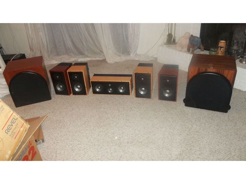 Revel performa speaker sets (willing to sell separately): two B15 subs, two M22 speaker sets, one C32 speaker. Natural cherry and maple finishes, lightly used with boxes