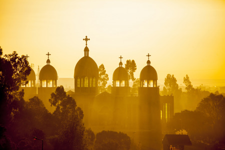 Ethiopian orthodox church with sunrays in Addis Ababa at dawn.jpg