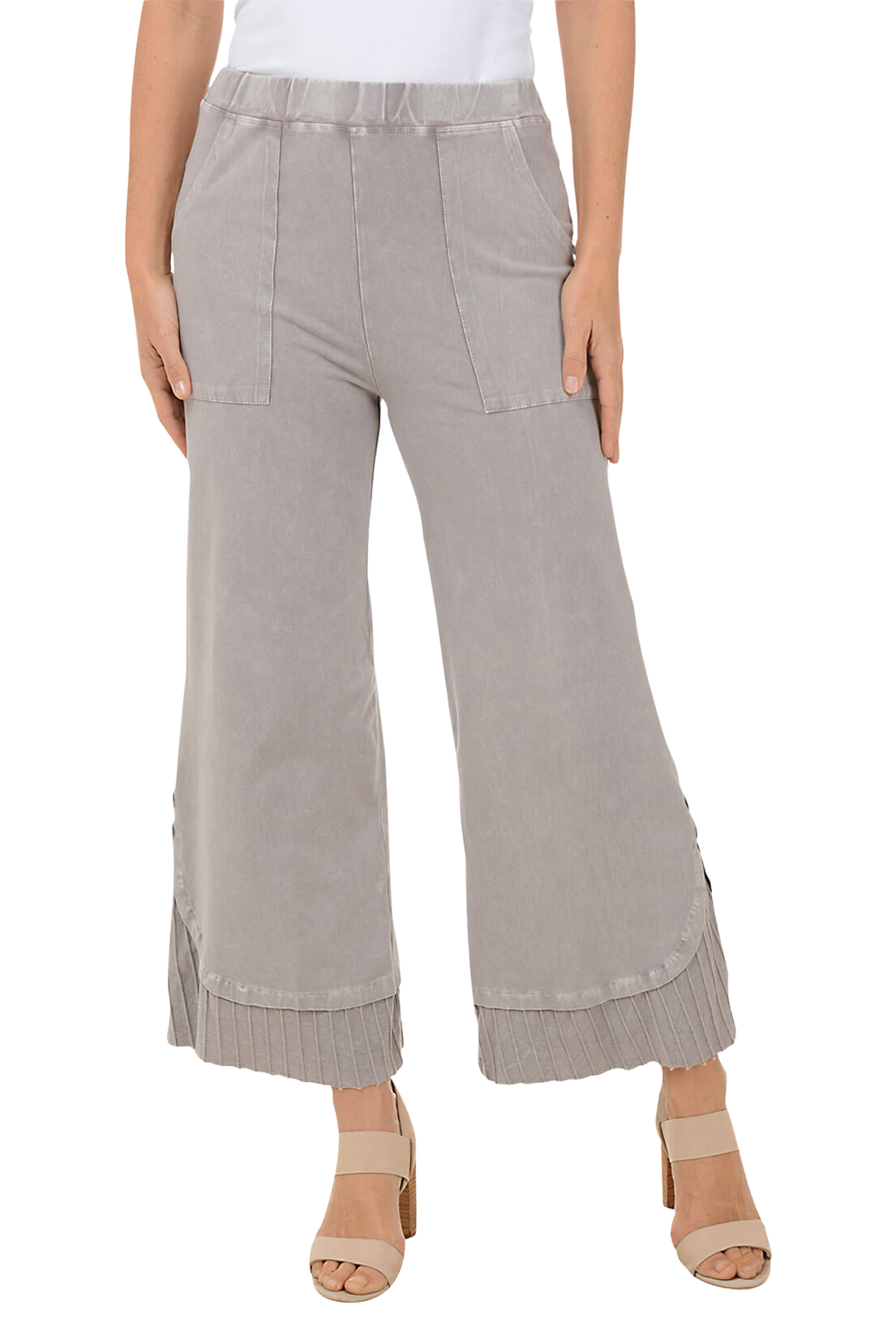 A woman wears a pair of wide-leg pants.