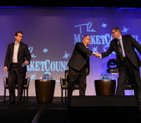 More comity than comedy. Mark Tibergien shakes hands with Bernie Clark as Mike Durbin looks on.