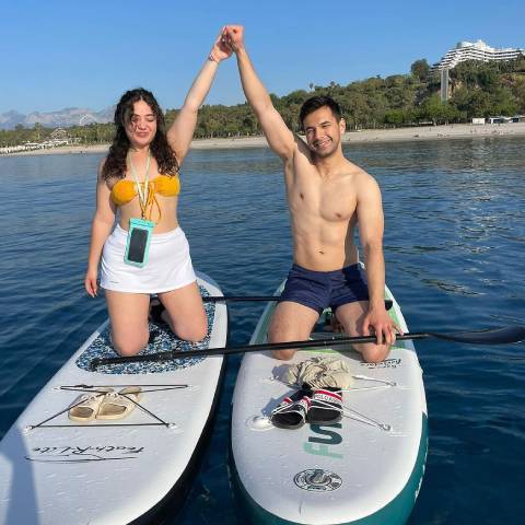 Couple on their Feath-r-lite paddle board happily