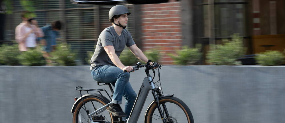 a man riding a Velotric E-Bike on the street