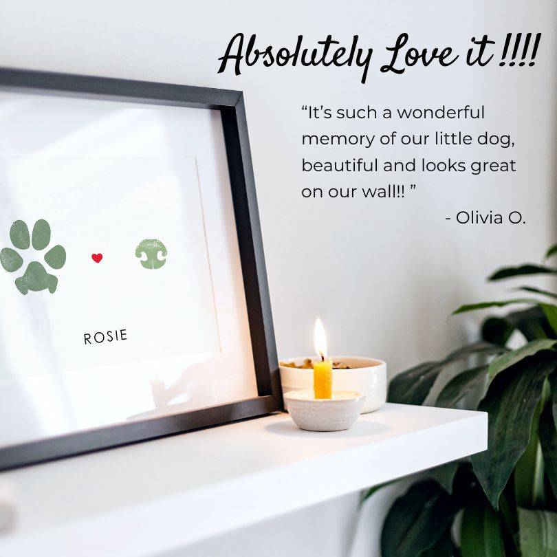 Customer review with photo of dog paw print and dog nose print in black frame on shelf with candle