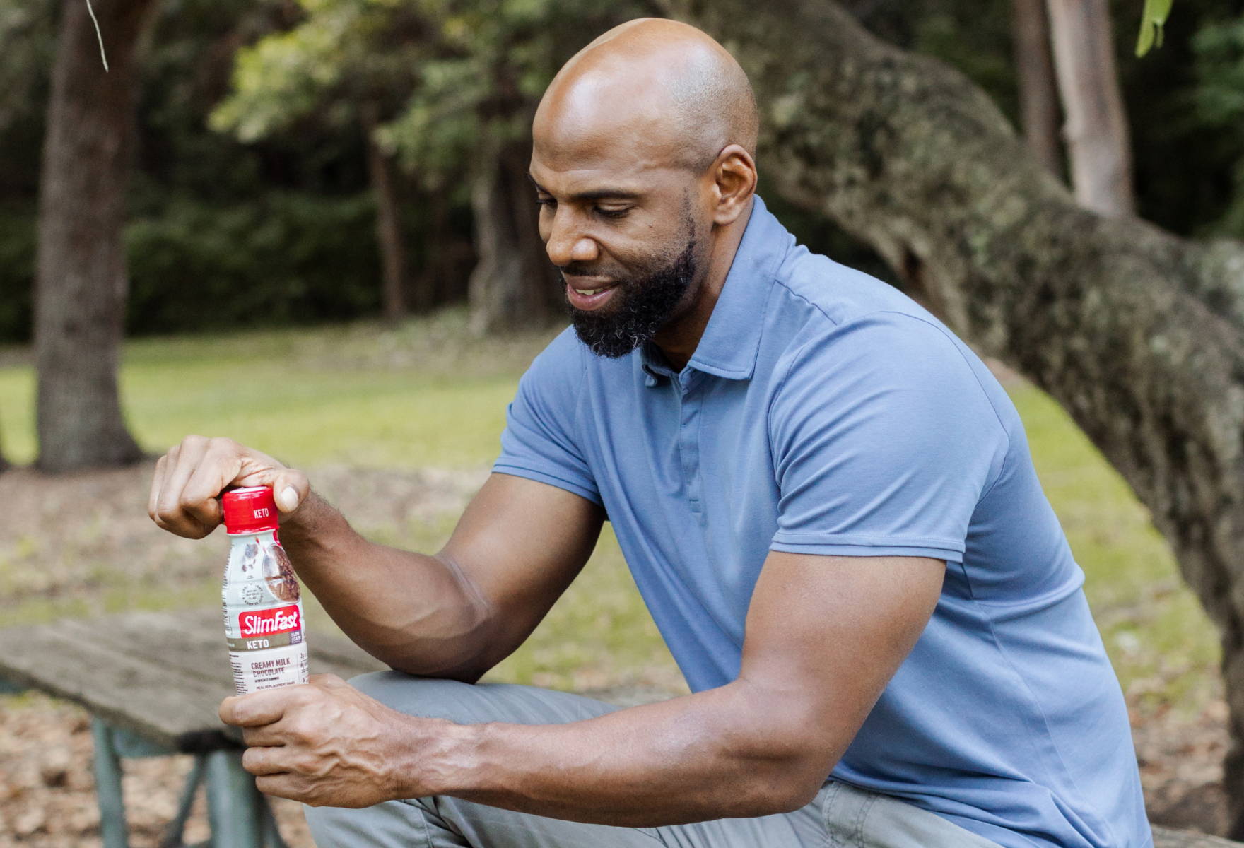 Keto Meal Shake to Go- lifestyle image of handing holding a bottle