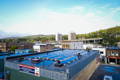 rooftop of the frost river store covered in solar panels with the duluth hillside in the background