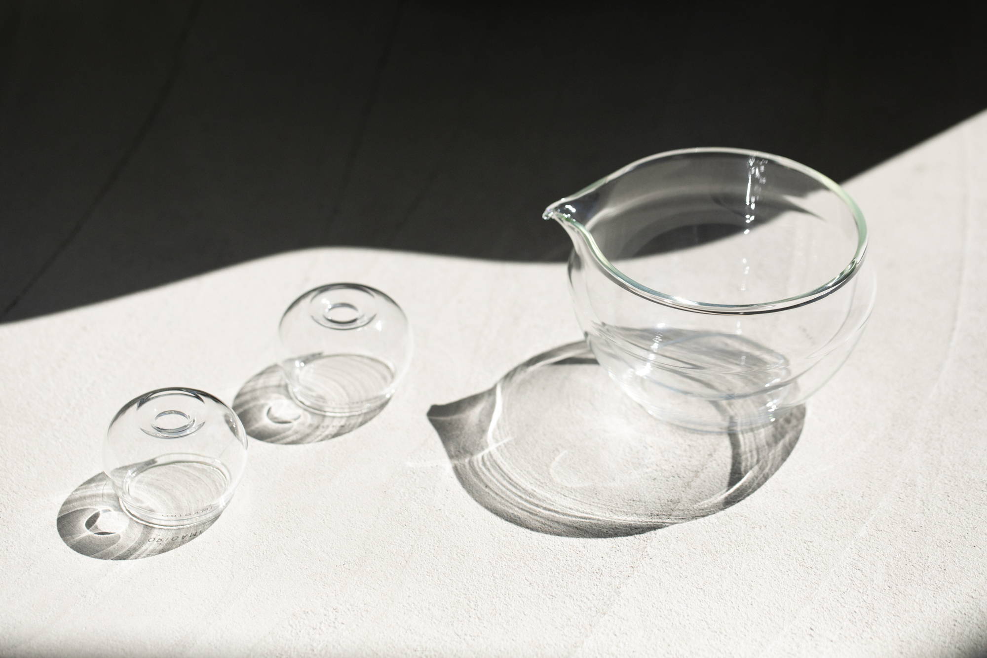 ORIGAMI Tea glass matcha bowls and whisk stands in sunlight