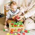 Mother showing the wooden pieces of the Montessori Carrot Wheel to her baby boy.