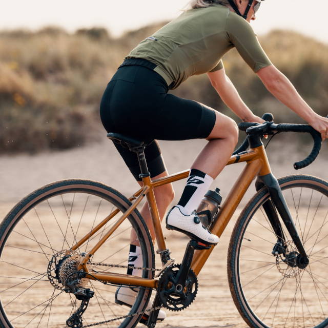 A e-MTB on a large grassy hill.
