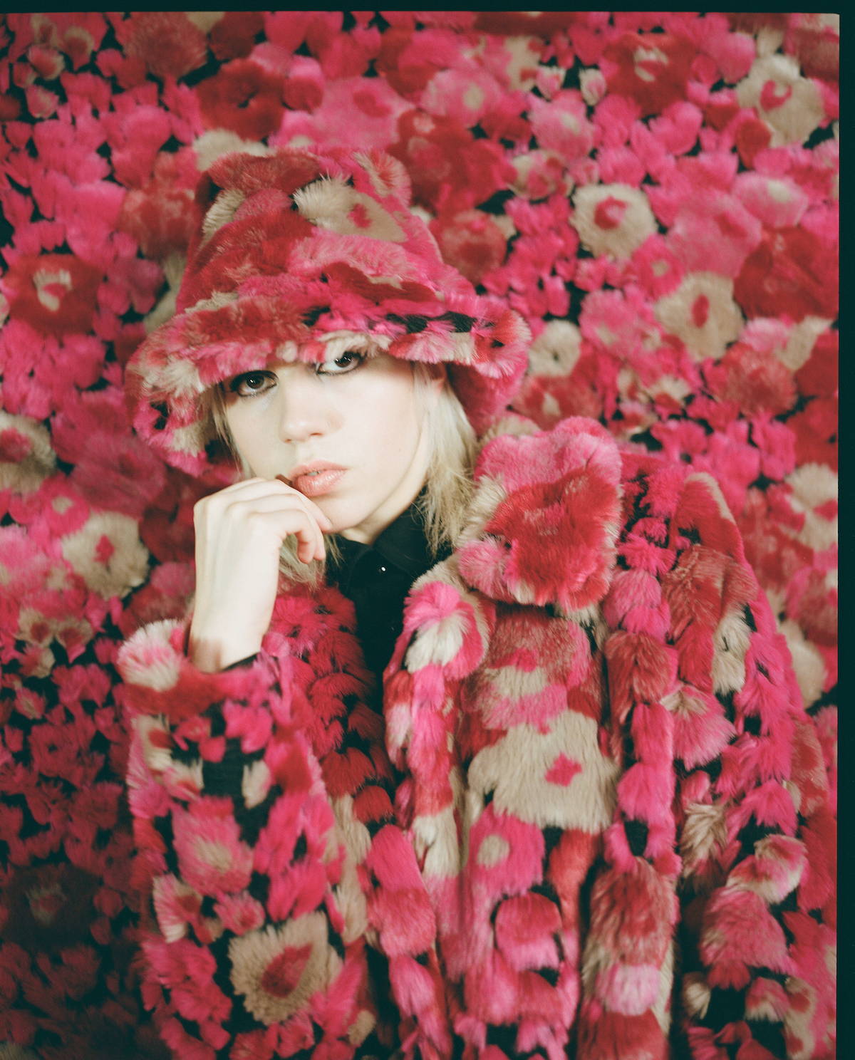 Anna sui fall winter campaign page with julia cumming on a pink background