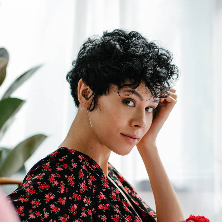 woman with dark hair in a pixie cut