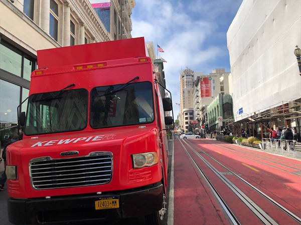 Kewpie food truck next to BART track