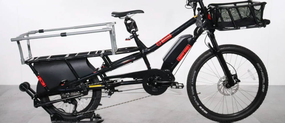 a black Yuba Spicy Curry electric cargo bike