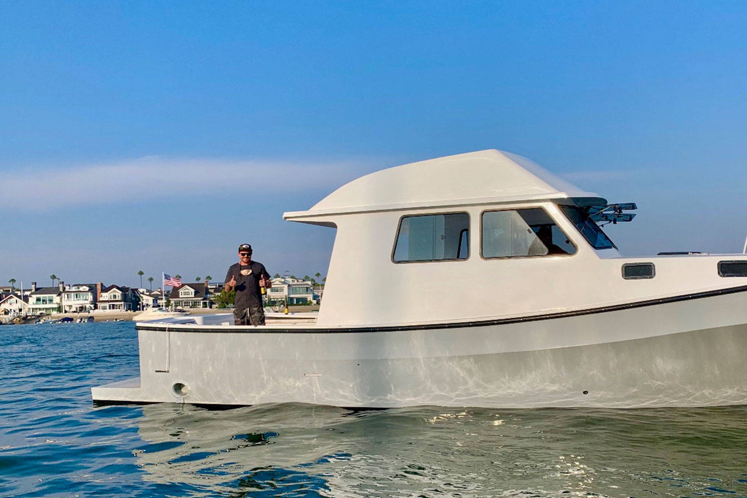 The owner Thomas Carson on his boat in the Newport Beach Harbor