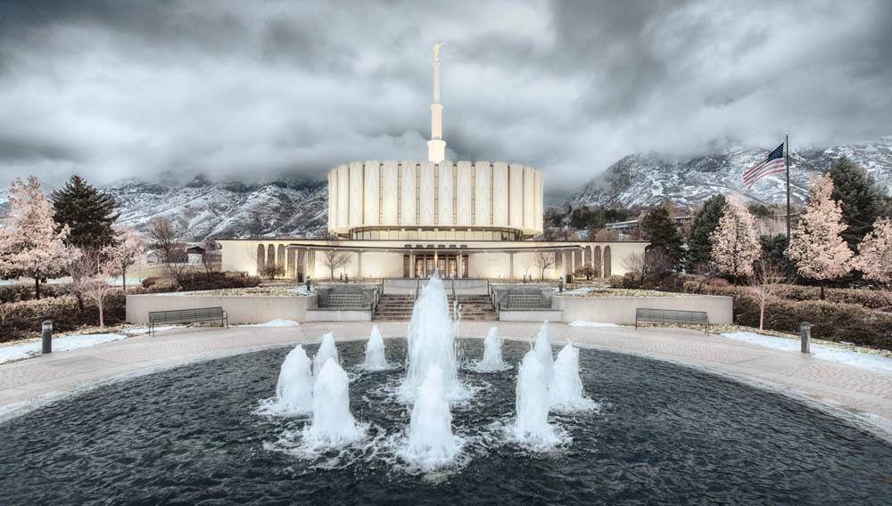 Provo Temple and water fountain surrounded by snowfall
