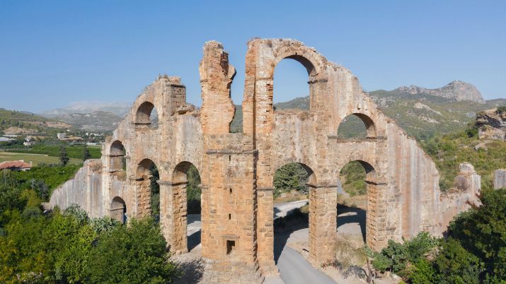 The city features a well-preserved Roman aqueduct supplying water and the Eurymedon Bridge, one of the world's oldest standing bridges, showcasing advanced Roman engineering