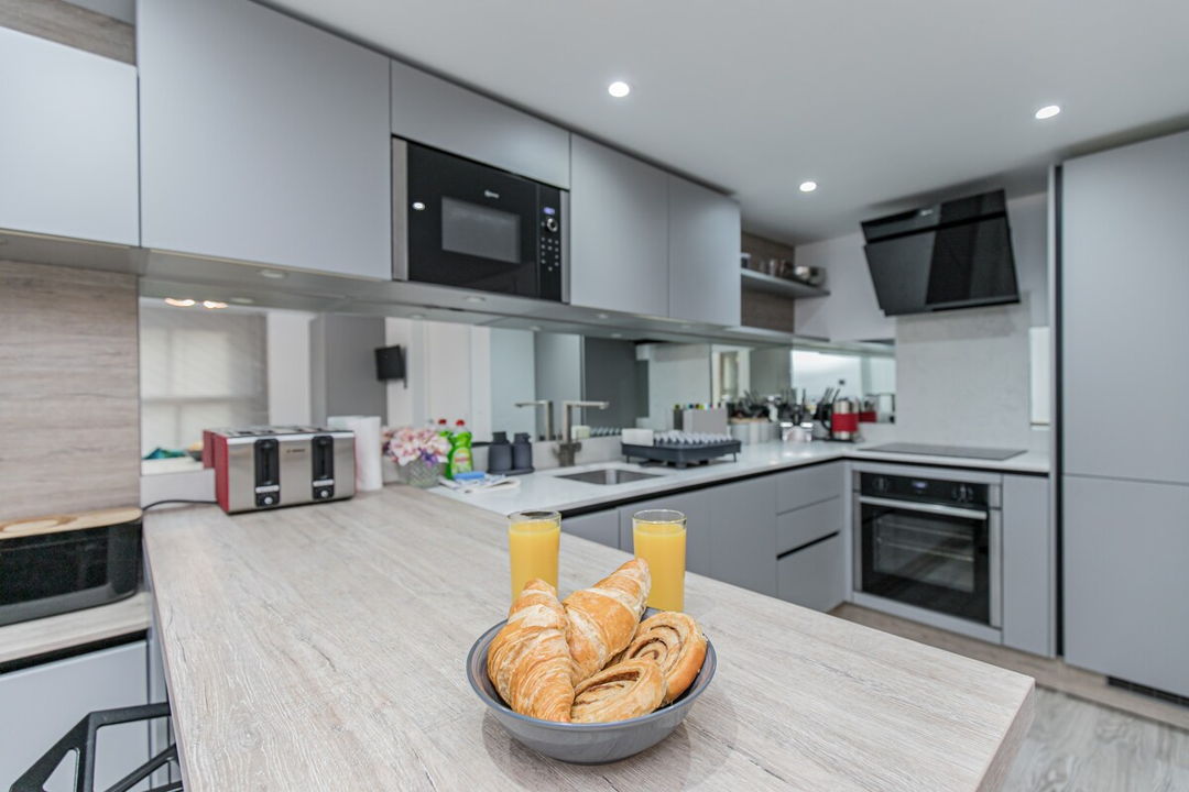 Close up of the breakfast bar and kitchen with all modern amenities