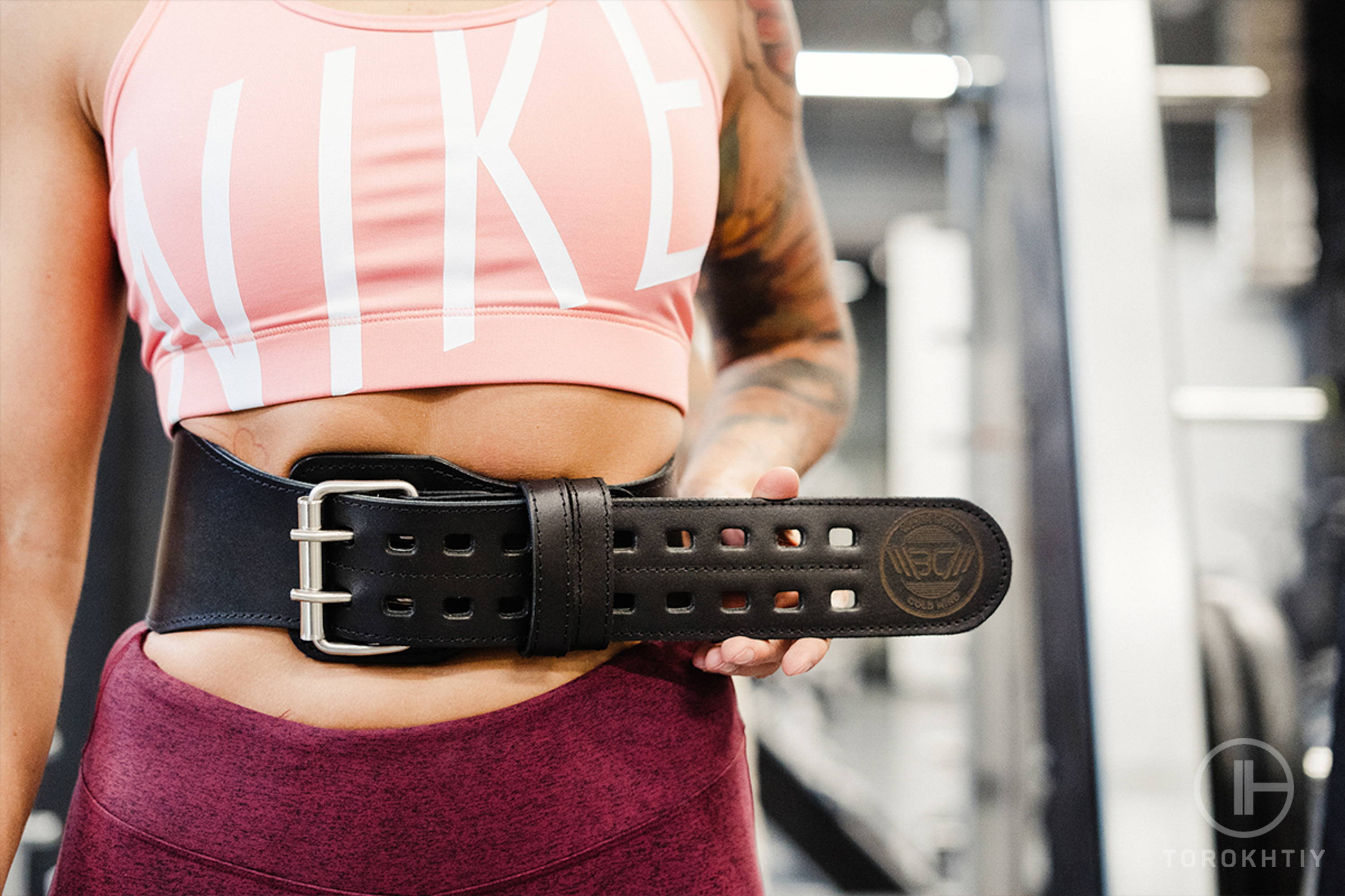 Athlete with a Weightliftingbelt in Gym