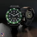 42mm DLC-black Classic case with leather strap and green bezel.