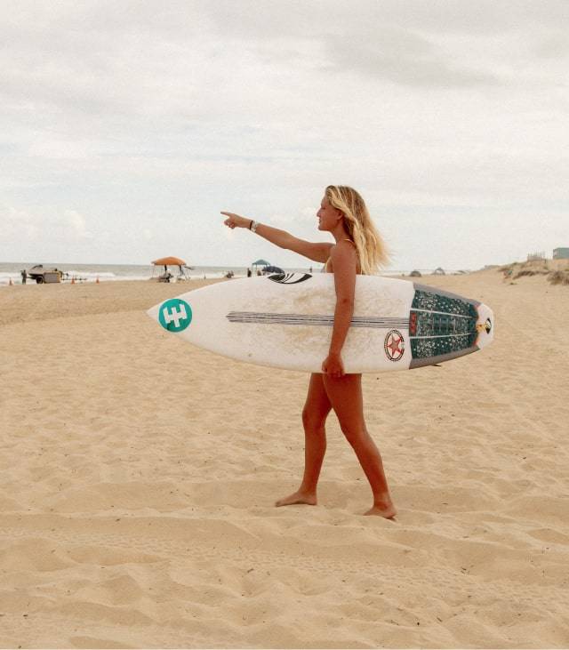 #EidonAdventurer Carlie Eastwood at the beach, heading to a surf session.