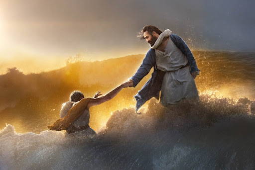 Jesus rescuing Peter from the crashing waves.