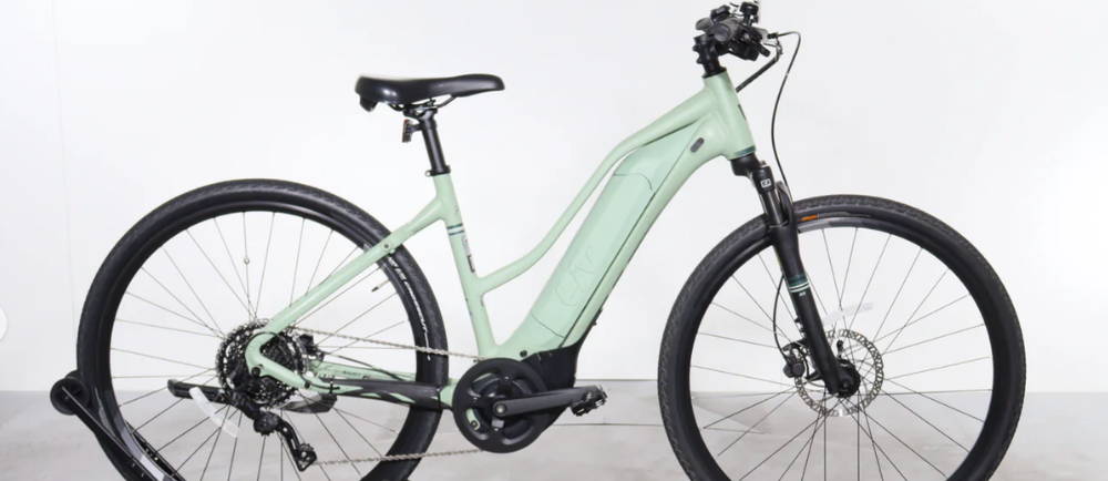 A light green Giant Liv Rove E+ electric city bike
