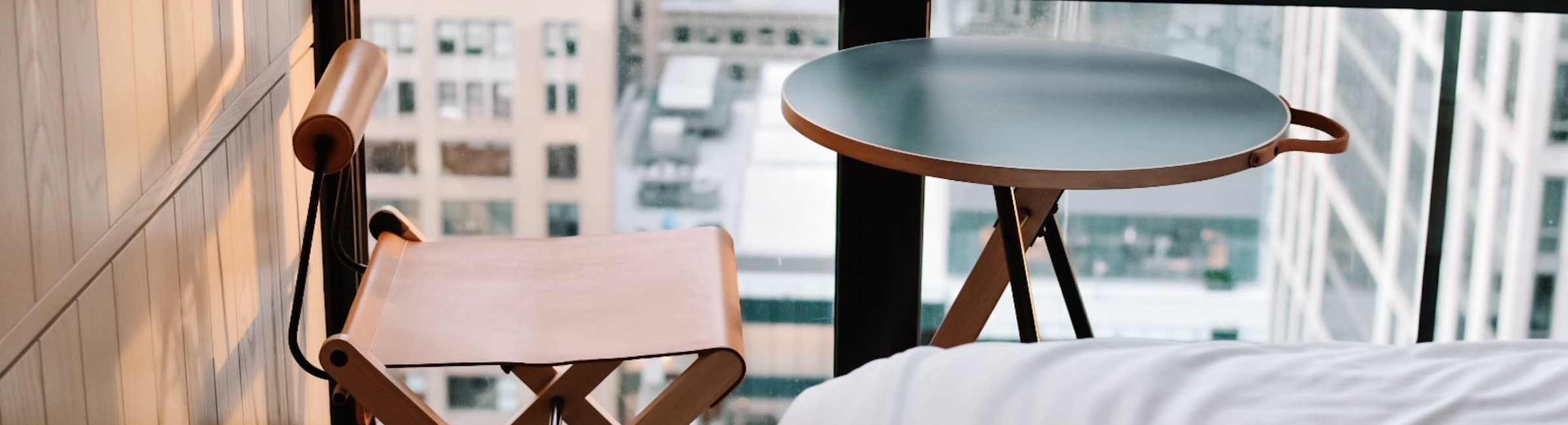 small table in window looking over New York